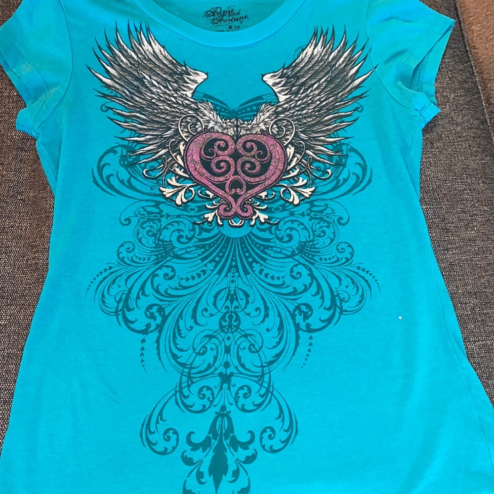 I really love this shirt medium has been worn but has been washed already